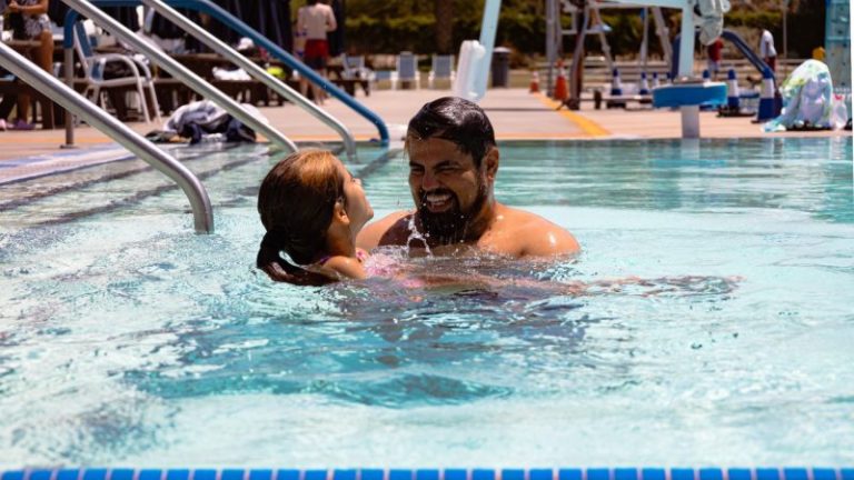Recreational pool - A father and daughter enjoying the pool together.